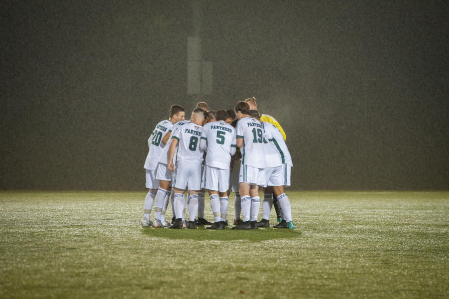 Soccer players huddle