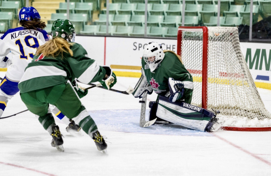 A goalie makes a save in an ice hockey game