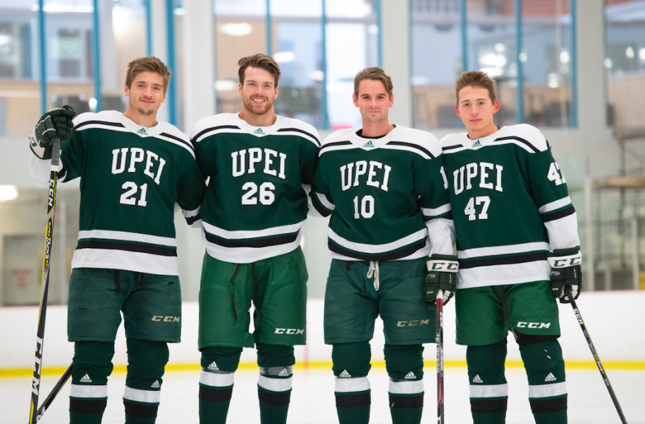 Four male hockey players