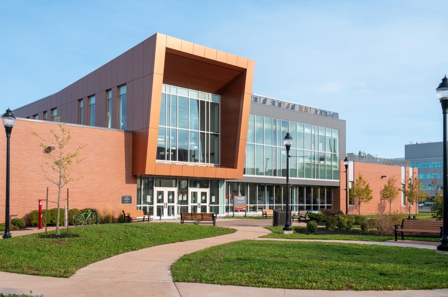 A modern institutional building with lots of glass and brick