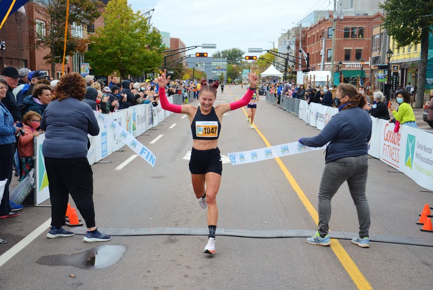 Top female runner Rachel crosses the finish line at the PEI Marathon. Photo: Jason Simmonds, The Guardian Crossing the finish line. Photo: Jason Simmonds, The Guardian