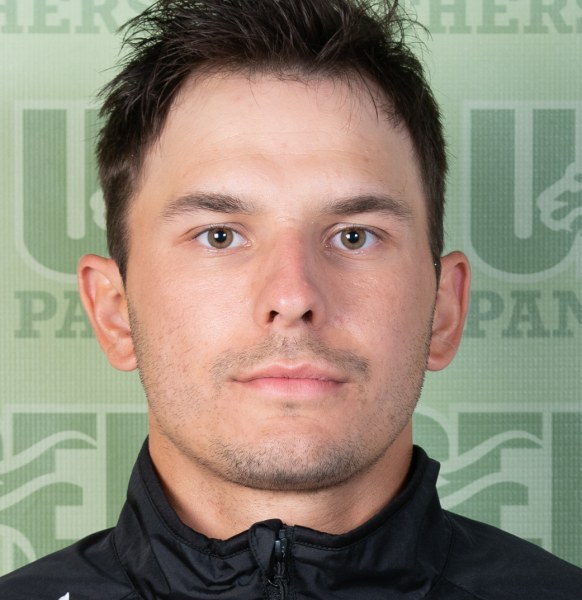 A serious-looking male athlete in Panthers hockey gear