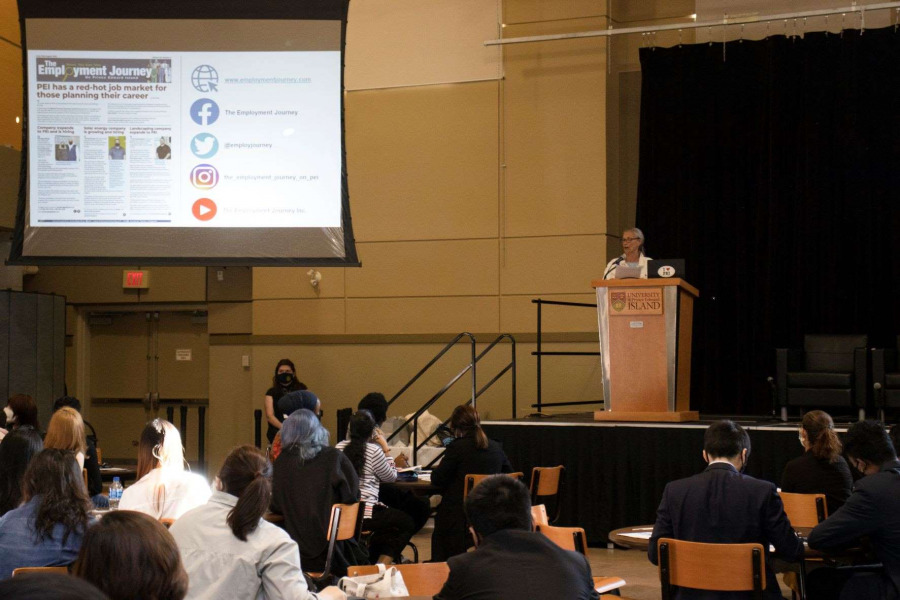 Gloria Welton, owner of The Employment Journey, addresses graduates of the Classes of 2021 and 2022.