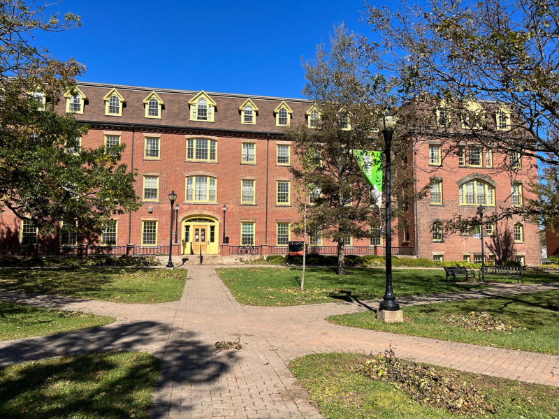 Photo of SDU Main Building on a sunny day with blue sky