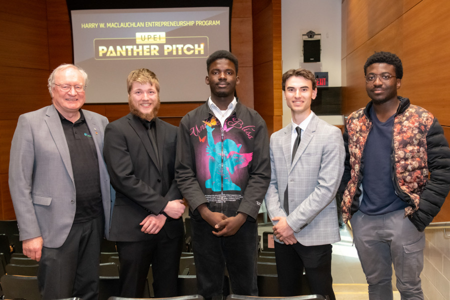 From left to right:  H. Wade MacLauchlan (representing the family of Harry W. MacLauchlan), Evan Hutchinson (Harvest Moon Blueberry Syrup), Jerry Oriade (Finix), Matt Jelley (Mobile Bike Services), and Chinemerem Mbonu (Skibble).