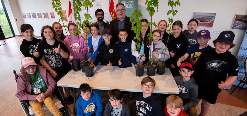 a group of students with Dr. Farooque and Minister Myers