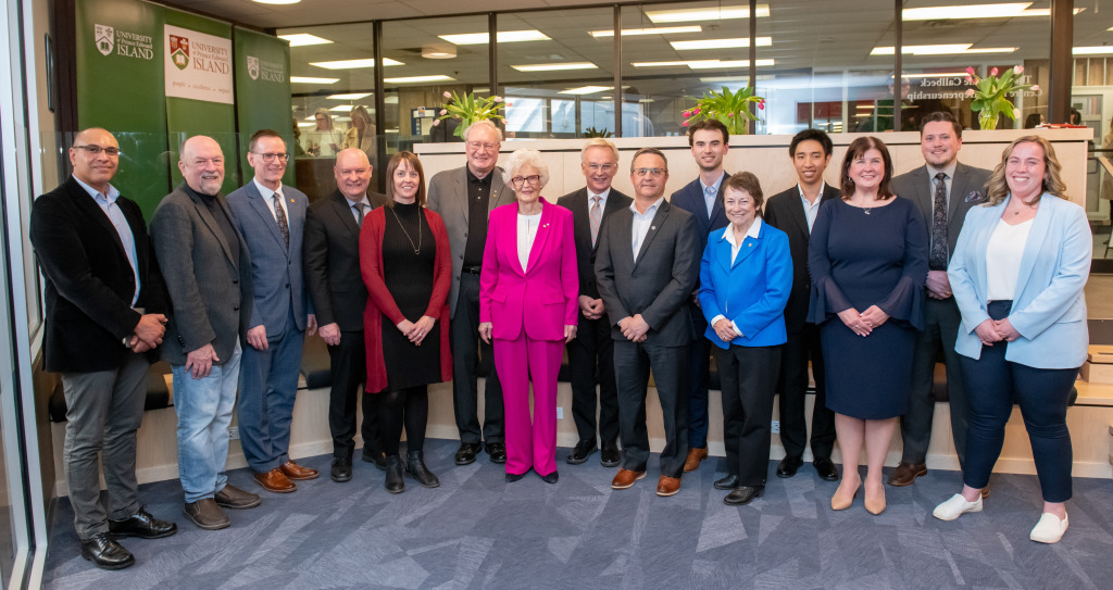 Photos of a large group of people standing in entrepreneurship centre