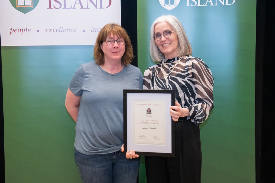 Angela Driscoll receives a University Award for Exemplary Service from Dr. Wendy Rodgers, UPEI President and Vice-Chancellor Angela Driscoll receives a University Award for Exemplary Service from Dr. Wendy Rodgers, UPEI President and Vice-Chancellor