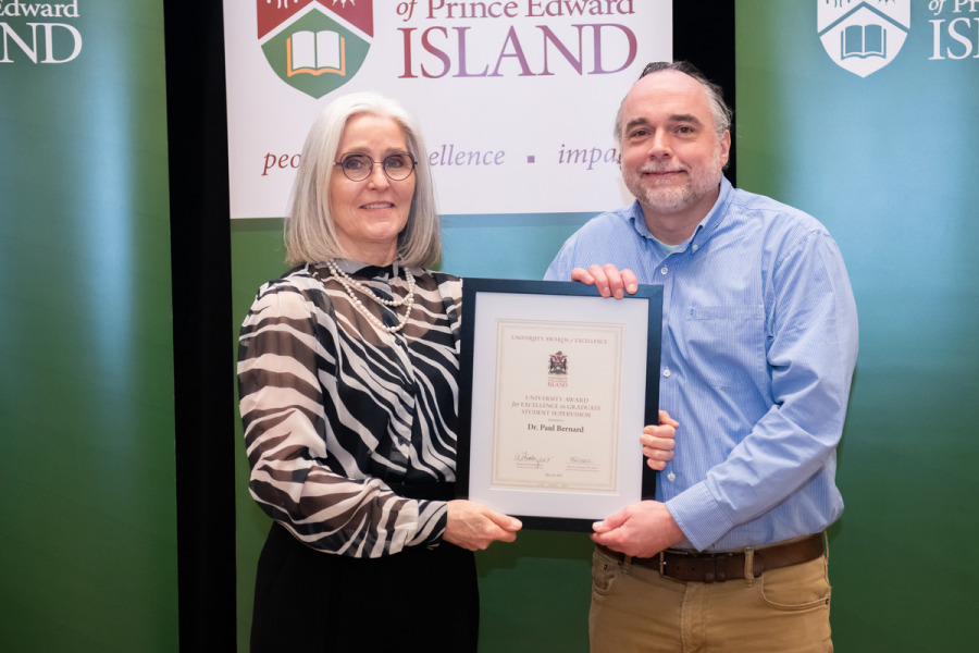 Dr. Wendy Rodgers, UPEI president and vice-chancellor, presents the award to Dr. Paul Bernard Dr. Wendy Rodgers, UPEI president and vice-chancellor, presents the award to Dr. Paul Bernard