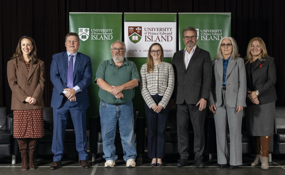 photo of group of people standing side by side on a stage
