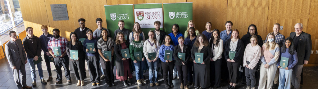 MacLauchlan Prizes for Effective Writing award winners with UPEI Vice-President Academic and Research, Greg Naterer (left) and UPEI President Emeritus, Wade MacLauchlan (right)