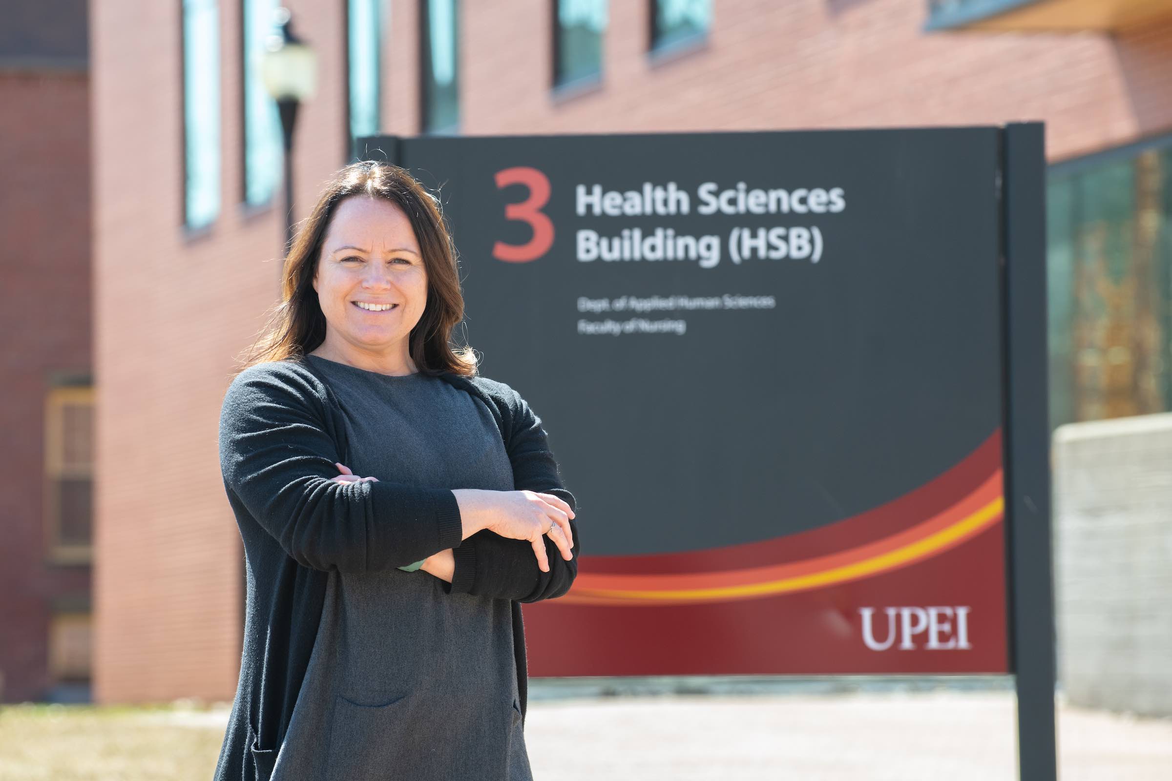 UPEI grad student and instructor Bethany Vessey by the Health Sciences Building
