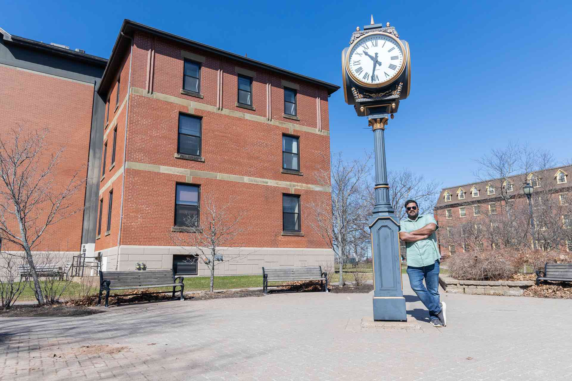 UPEI paramedicine student Bibin Peter by the UPEI clock