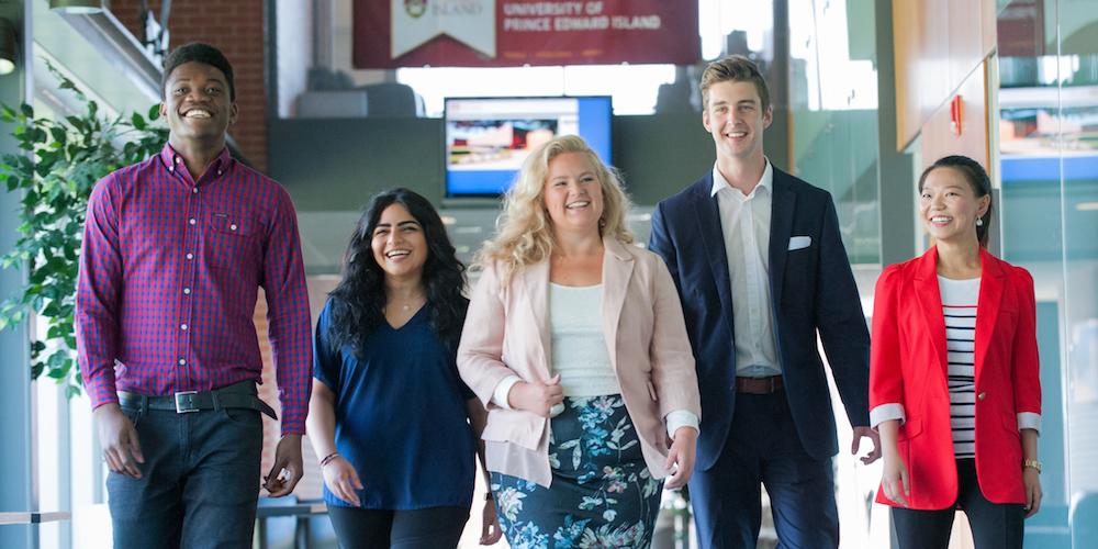 five business students walking in upei's mcdougall hall