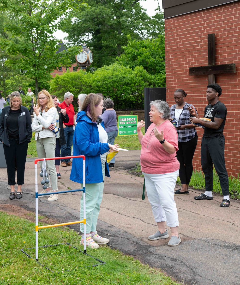 Sister Sue chatting with members of the UPEI campus community