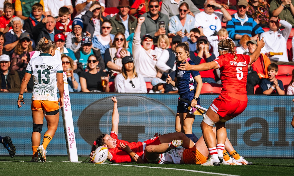 Team Canada rugby athlete Alysha Corrigan celebrating a try with teammates