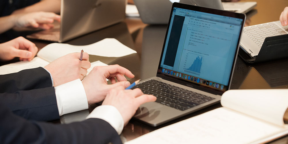 students working on a laptop