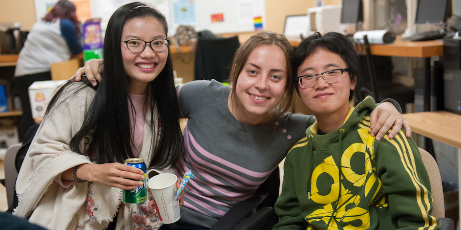 three students at campus life movie night