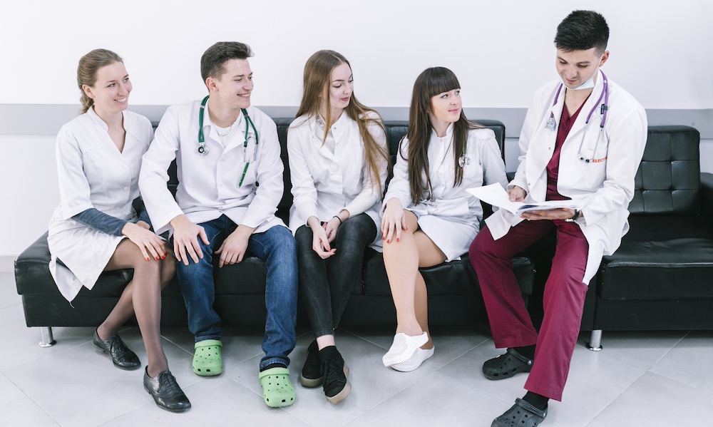 a group of medical students on a sofa