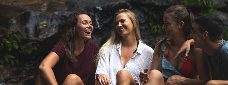 a group of students laughing outdoors