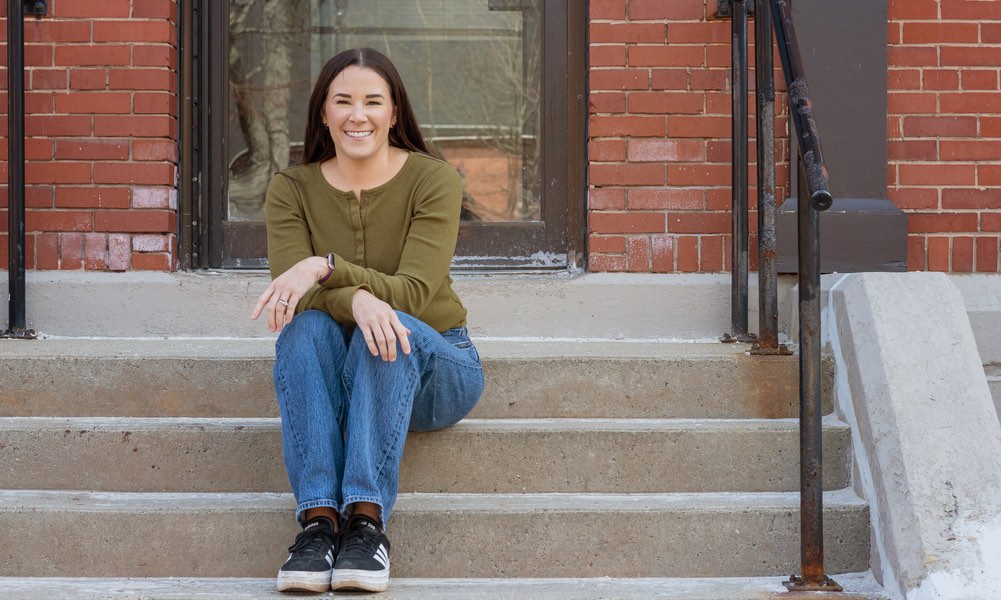 UPEI Paramedicine graduate Kellie MacLeod on the steps of Cass Science Hall