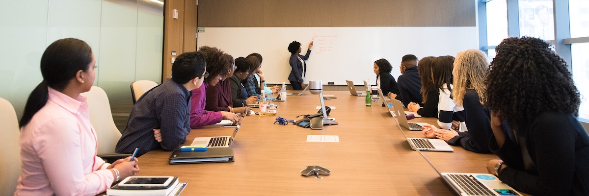 a group of professionals in a boardroom