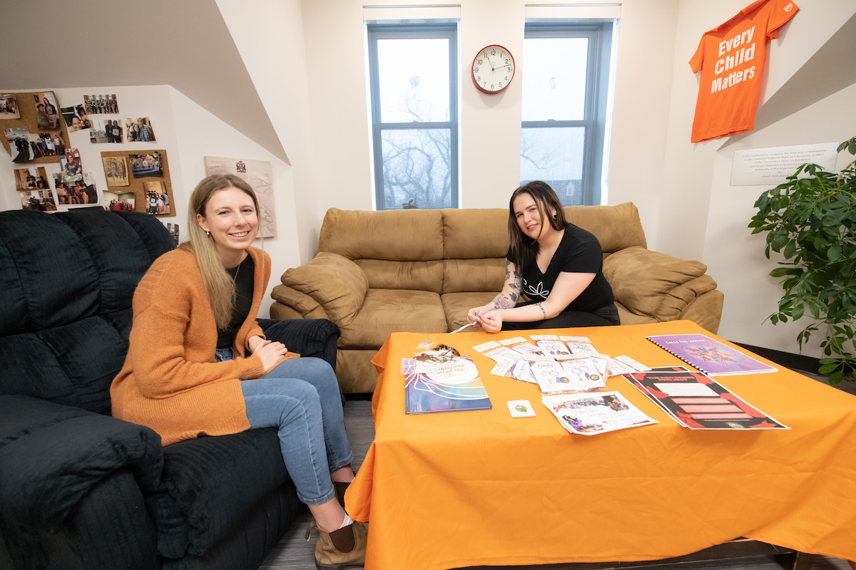 two people working at a low table 