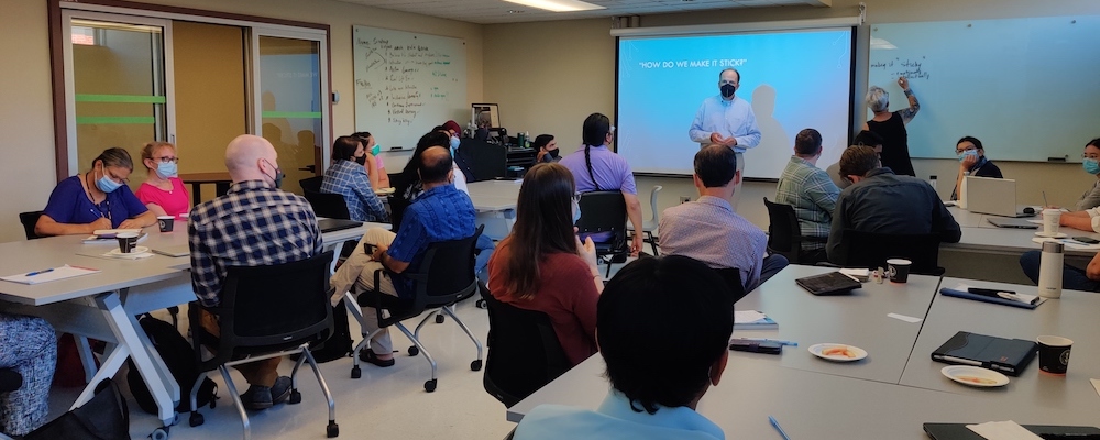 a group of UPEI professors and instructors participating in a training session