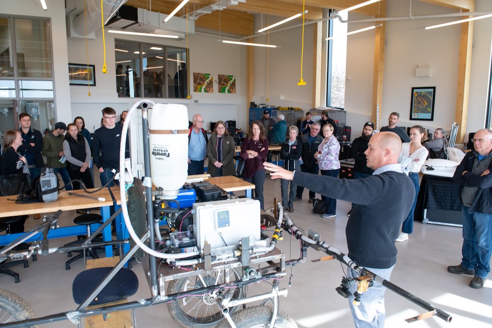 a staff member presenting to a group of people 