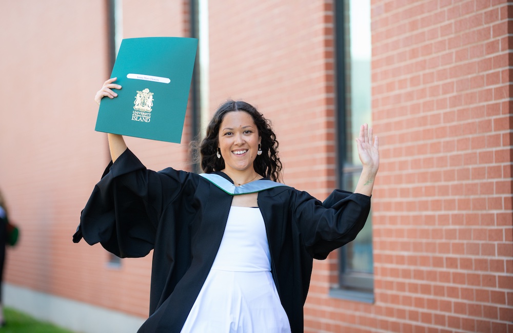 UPEI graduate Jenna Flowers with her parchment at Convocation