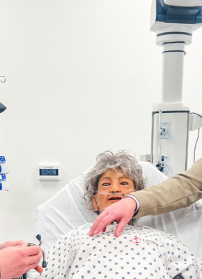 Jeff Clow (right), Director of Academic Affairs, UPEI Faculty of Medicine, shows Michael Gill (left), son of UPEI employees Anthony and Rebecca Gill, how to use a stethoscope on a manikin during a tour of the Clinical Learning and Simulation Centre in the Faculty of Medicine and Interprofessional Health Education Facility.