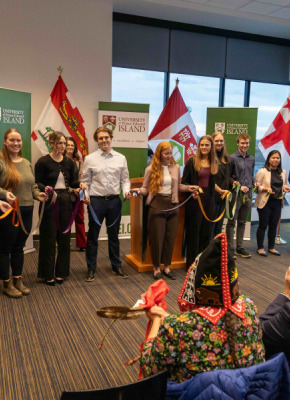 photo of a group of students holding pieces of ribbon