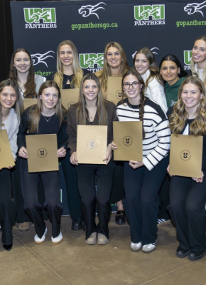 Members of the UPEI Women’s Hockey team gather for a photo after they receive their U SPORTS Academic All-Canadian certificates.