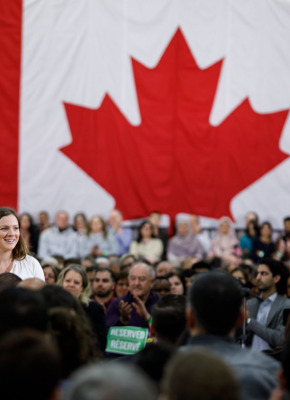 Kate VanGerven at a ministerial announcement with a large crowd