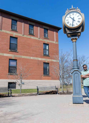 UPEI paramedicine student Bibin Peter by the UPEI clock