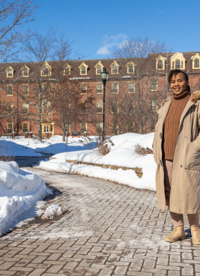 UPEI graduate Patience Adaobor standing in the quad in winter