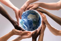 image of diversity, hands around globe