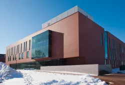 A large institutional building of brick and glass