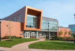 A modern institutional building with lots of glass and brick