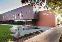 A modern institutional building with lots of glass and brick