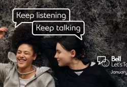 photo of two women listening and talking with Bell Let's Talk graphic