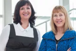 photo of two women standing side by side