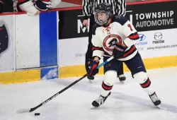 photo of female hockey player skating 