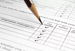 photo of pencil filling in survey form