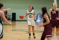 Female basketball player dribbling the ball during a game