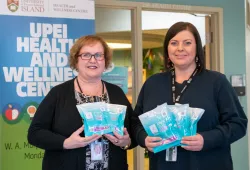 Marilyn Barrett, director of the UPEI Health and Wellness Centre, and Adrienne Fudge, RN, display HIV self-testing kits available through the I’m Ready to Know program.