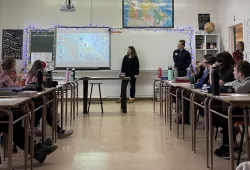 UPEI Faculty of Nursing students Lauren Giroux and Ben MacMillan conduct a Youth Vaping Awareness Day educational session with a grade 7 class at Birchwood Intermediate.