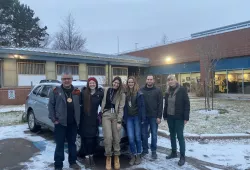 (From left to right): Elder Junior Peter Paul, Raelyn McCurdy, Dr. Giuliana Obeid, Dr. Lara Cusack, Dillon Scott, and Fiep de Bie preparing to transfer "Buddy" to Hope for Wildlife. 