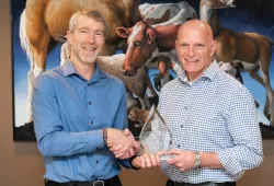 Dr. Larry Hammell, professor of health management, Atlantic Veterinary College, accepts the AVC Atlantic Award of Excellence in Veterinary Medicine and Animal Care Award from Dr. John VanLeeuwen, interim dean, AVC.