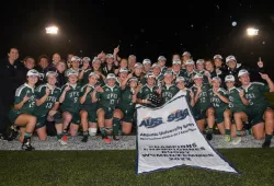 The UPEI Women’s Rugby Panthers display their championship banner after winning the AUS championship in 2022.